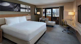 Image of a single bed in a Lake-View Patio Room.