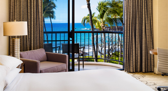 Image of a single bed in a Makai Oceanfront Room.