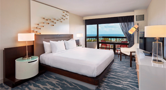 Image of a single bed in a Water-View Room with Balcony.