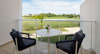 Photo of hotel room balcony with very of greenery.