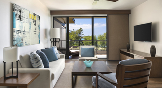 A view of the seating area and view from the Beach House One-Bedroom Suite balcony.