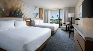 Photo of hotel room with two queen beds.