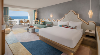 This image shows a contemporary bed with a ocean-facing view.