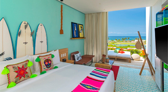 Image of a single bed in a Deluxe Ocean-View Room.