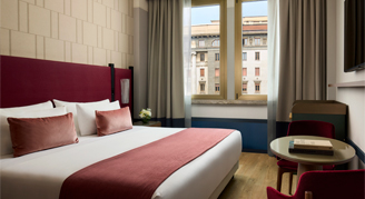 Photo of Premium XL Room with king bed and large windows.