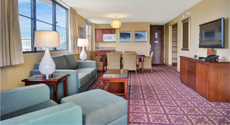 sofa, dining table and chair in an ocean front suite