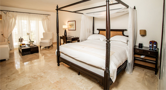 Image of a single bed in an Oceanfront Junior Suite with Lanai.