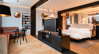 Image of the living area and open bedroom of the Junior Suite.