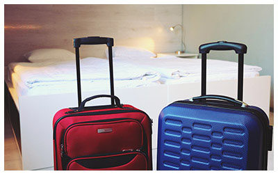 Image of luggage in a hotel room.
