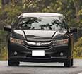 Image of a black sedan rental car.