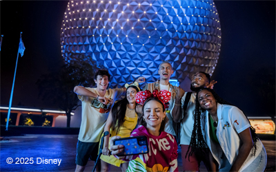 Group of young people taking a selfie in front of EPCOT®